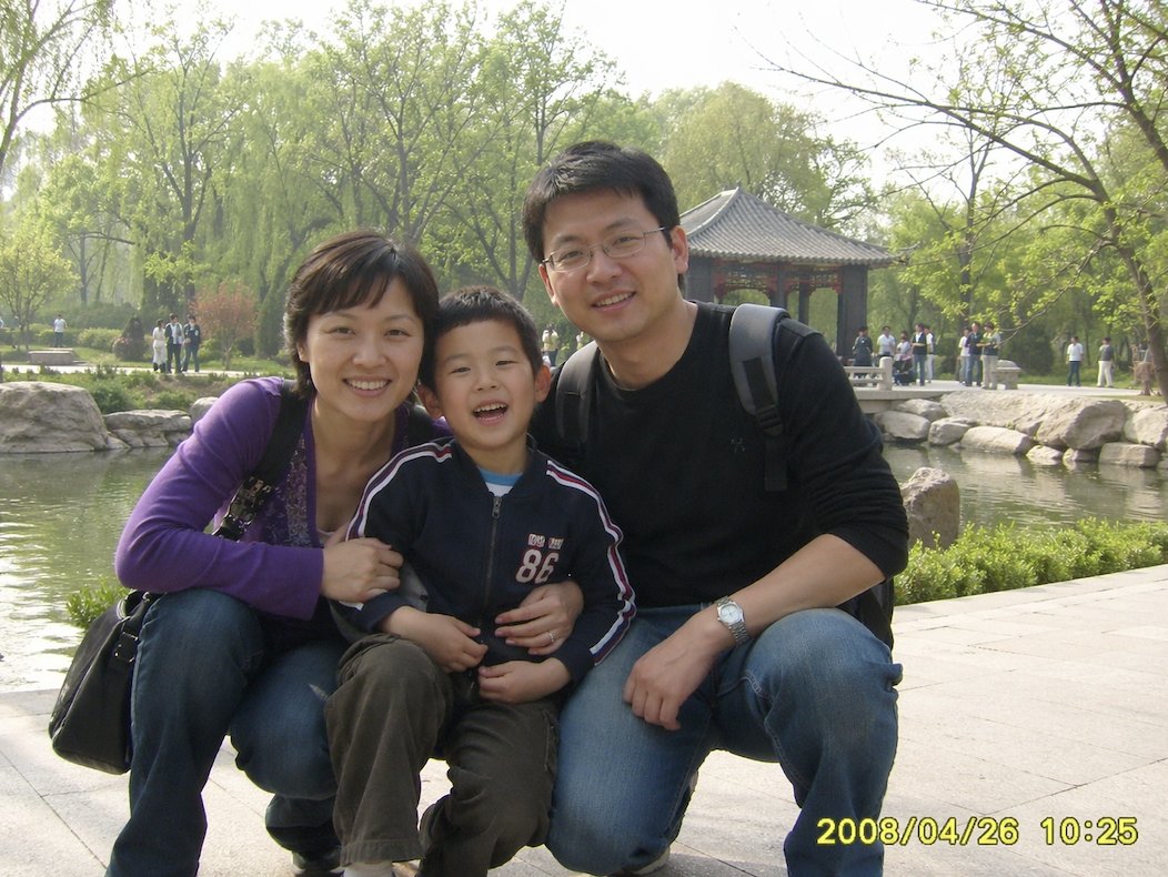 A candid family snapshot styled like a consumer digital camera photo from around {argument name="year" default="2008"},…