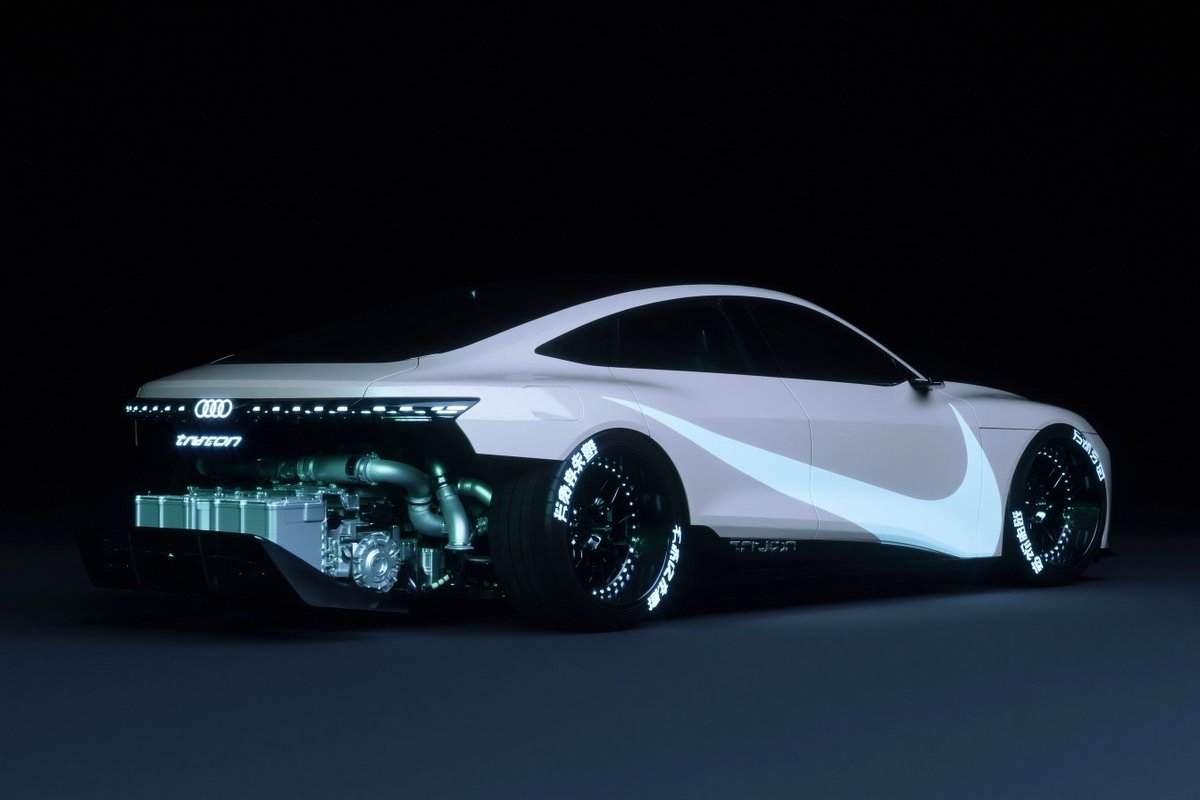 A futuristic concept coupe based on an {argument name="car brand" default="Audi"}, shown in a low rear three-quarter si…