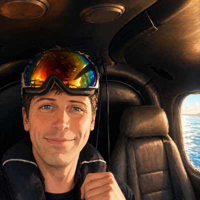 A candid close-up selfie inside a small helicopter cabin, shot from the front-facing phone camera, with one adult passe…