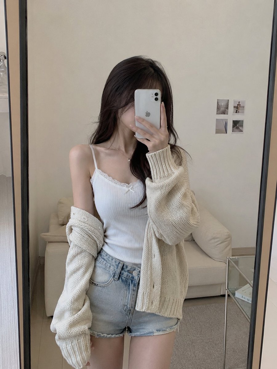 Create a highly realistic casual mirror selfie of a {argument name="subject" default="young East Asian woman"} standing…