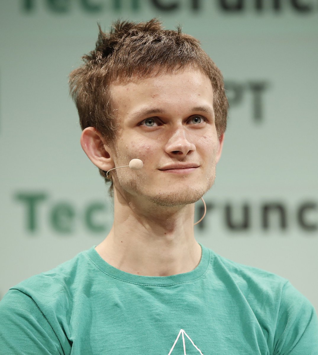 Create a realistic press-conference portrait photo of {argument name="speaker description" default="a young adult man w…