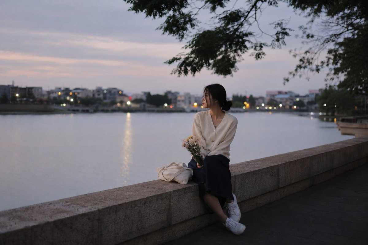 A relaxing and quiet evening riverside scene: {argument name="time" default="late summer evening"}, {argument name="set…