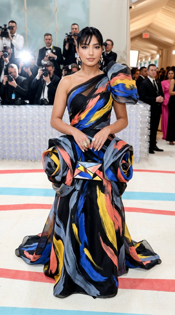 Ultra-photorealistic Met Gala fashion image of an adult woman wearing an {argument name="outfit" default="original avan…
