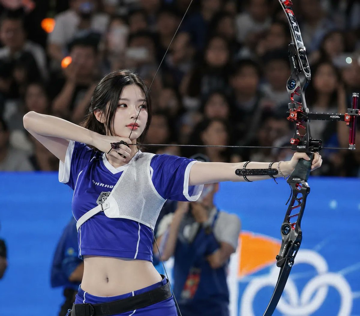 Ultra realistic sports photography, {argument name="subject" default="young East Asian female archer"} standing in a cr…