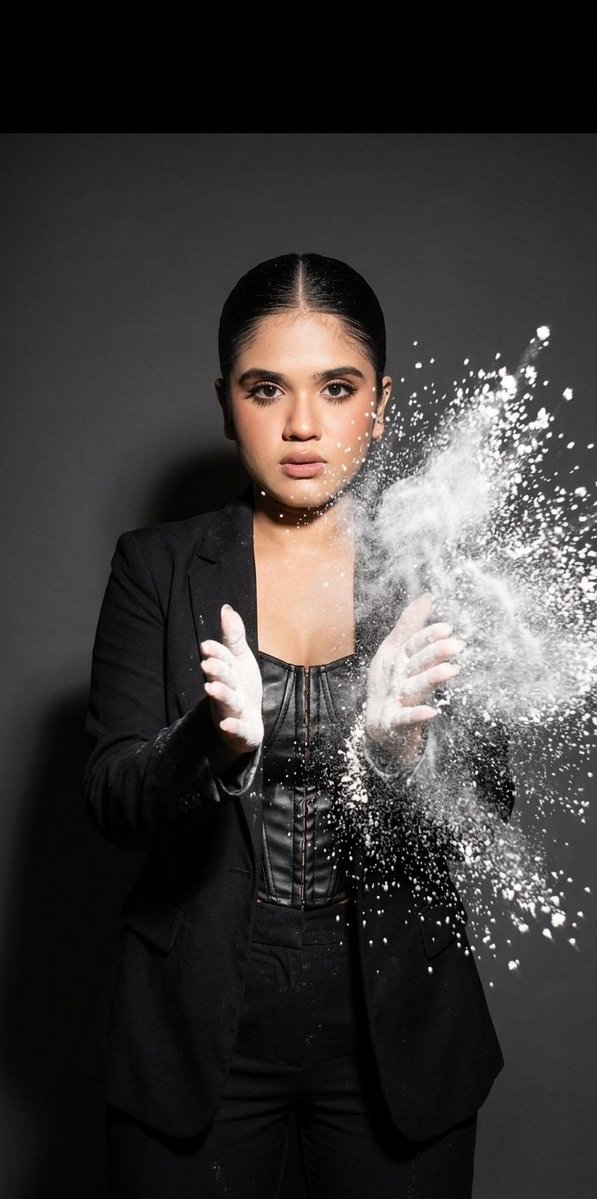 atmospheric studio action shot, dark solid background, harsh high-contrast flash, frozen motion, {argument name="lens" …