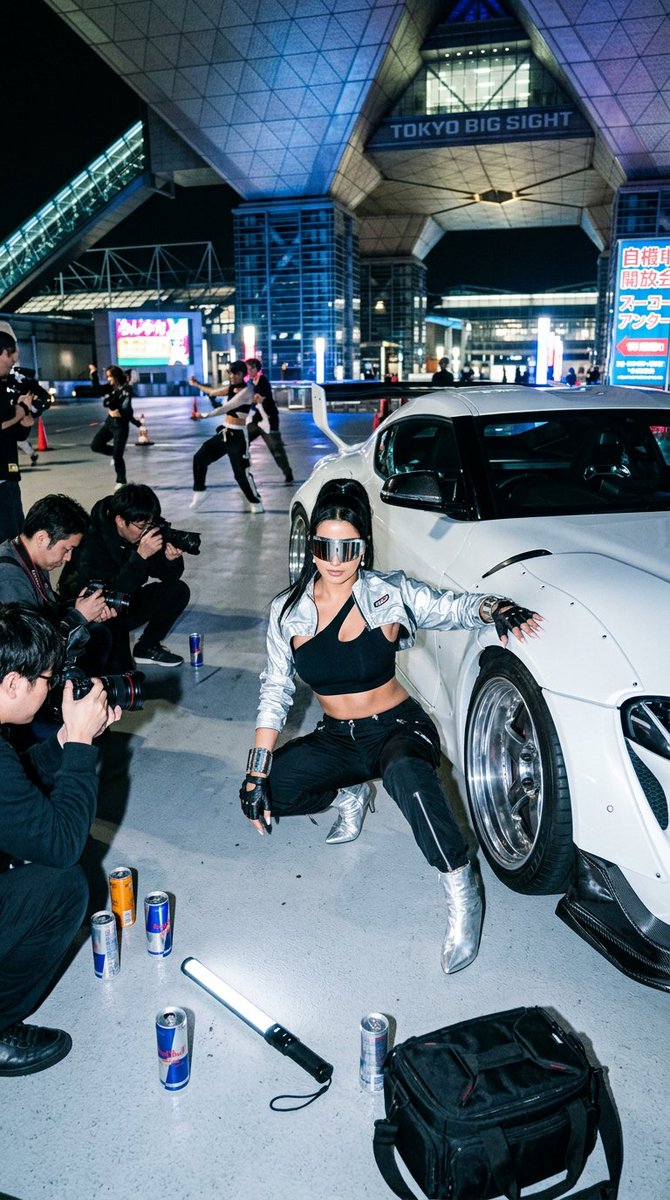 High-impact {argument name="setting" default="Tokyo drift-show editorial outside Tokyo Big Sight at night"}, shot at 24…