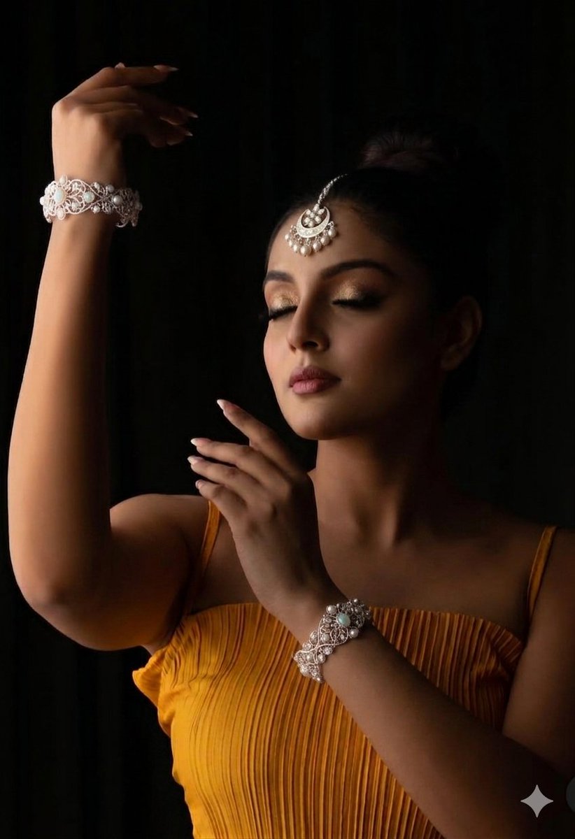 A high-fashion editorial studio portrait of a woman with her eyes softly closed, captured in a graceful, dramatic pose …